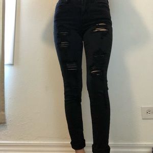 Black skinny jeans with holes